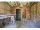 Rustic basement space featuring wood paneling and concrete floor, perfect for storage or workshop at 503 W Carolina Ave, Summerville, SC 29483