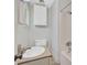 A clean bathroom featuring a single sink vanity, storage cabinet, toilet, and a shower-tub combination at 503 W Carolina Ave, Summerville, SC 29483
