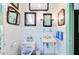 Well-lit bathroom featuring vintage tile, classic fixtures, and decorative mirrors, creating a timeless appeal at 503 W Carolina Ave, Summerville, SC 29483