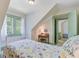 Bedroom with traditional desk space, floral bedding, and a bright window at 503 W Carolina Ave, Summerville, SC 29483