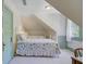 Cozy bedroom featuring twin beds, light-filled window, and an adjoining door at 503 W Carolina Ave, Summerville, SC 29483
