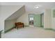 Spacious room with white carpet, a window, and a seating bench offering ample space at 503 W Carolina Ave, Summerville, SC 29483