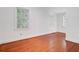 Sunlit room with hardwood floors and ample natural light from large windows with views of the outdoors at 503 W Carolina Ave, Summerville, SC 29483