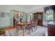 Formal dining room with a china cabinet, fireplace, and seating for six at 503 W Carolina Ave, Summerville, SC 29483