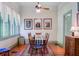 Dining room with natural light, vintage furniture, hardwood floors, and view of outside at 503 W Carolina Ave, Summerville, SC 29483