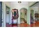 Elegant foyer features hardwood floors, arched doorways, and vintage furnishings at 503 W Carolina Ave, Summerville, SC 29483