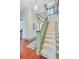 Inviting foyer featuring a carpeted staircase, hardwood floors, and elegant trim throughout at 503 W Carolina Ave, Summerville, SC 29483