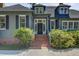 Inviting front entrance with brick steps, a classic door, and well-maintained landscaping at 503 W Carolina Ave, Summerville, SC 29483
