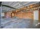 Large garage interior featuring exposed ceiling insulation and wooden walls, ready for customization at 503 W Carolina Ave, Summerville, SC 29483