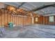 Spacious garage with exposed wood framing and concrete floor, offering ample storage or workshop space at 503 W Carolina Ave, Summerville, SC 29483