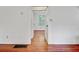 Bright hallway with wood floors, offering seamless transition between rooms at 503 W Carolina Ave, Summerville, SC 29483