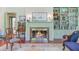 Charming living room features a fireplace, built-in bookshelves, and hardwood floors at 503 W Carolina Ave, Summerville, SC 29483
