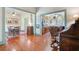 Inviting living room featuring hardwood floors, ceiling fan, and open layout to kitchen and dining area at 503 W Carolina Ave, Summerville, SC 29483
