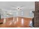 Open concept living area with hardwood floors and cozy fireplace, perfect for entertaining at 503 W Carolina Ave, Summerville, SC 29483