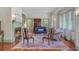 Cozy living room with a fireplace, hardwood floors, and stylish furniture at 503 W Carolina Ave, Summerville, SC 29483