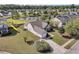 Aerial view of a home with a fenced backyard, mature trees, and lake views at 5033 Carrington Ct, Summerville, SC 29485