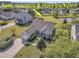 Aerial view of spacious, open backyard with pond access, featuring a playset and well-maintained lawn at 5033 Carrington Ct, Summerville, SC 29485