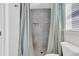 Modern bathroom featuring a tiled shower with glass door and neutral-colored curtain at 5033 Carrington Ct, Summerville, SC 29485