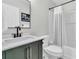 Modern bathroom with a sleek vanity, mirror, and shower tub combo at 5033 Carrington Ct, Summerville, SC 29485