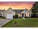 Charming single-story home with a well-manicured lawn and a two-car garage at 5033 Carrington Ct, Summerville, SC 29485