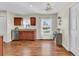 Open kitchen with stainless steel appliances, granite countertops, and wood-look flooring at 5033 Carrington Ct, Summerville, SC 29485