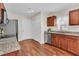 A charming kitchen featuring granite countertops, stainless steel appliances, and wood floors at 5033 Carrington Ct, Summerville, SC 29485