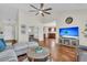 Open-concept living area with vaulted ceilings, wood floors, and great natural light at 5033 Carrington Ct, Summerville, SC 29485