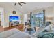 Cozy living room featuring hardwood floors, a ceiling fan, and sliding doors to a screened patio at 5033 Carrington Ct, Summerville, SC 29485