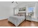 A spacious main bedroom with lots of natural light and wood-look flooring at 5033 Carrington Ct, Summerville, SC 29485