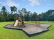 A fun-filled playground area for , complete with swings and a slide, set against a backdrop of lush greenery at 5033 Carrington Ct, Summerville, SC 29485