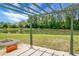 Scenic view of a tranquil lake from the backyard with a beautiful pergola at 515 Flycatcher Dr, Goose Creek, SC 29445