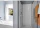 Bright bathroom featuring a tub to the left of a glass door shower at 515 Flycatcher Dr, Goose Creek, SC 29445