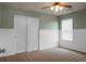 Bedroom with light green walls, carpeted floor, closet, and window at 515 Flycatcher Dr, Goose Creek, SC 29445