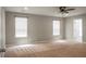 Large bedroom with neutral walls, carpet, and two windows, offering a comfortable and inviting atmosphere at 515 Flycatcher Dr, Goose Creek, SC 29445