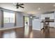 Open-concept living space with hardwood floors and sliding glass doors to the outdoors at 515 Flycatcher Dr, Goose Creek, SC 29445