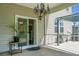 Covered patio with view to the screened-in porch, providing a relaxed outdoor living space at 515 Flycatcher Dr, Goose Creek, SC 29445