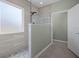 Modern bathroom featuring glass-enclosed shower and sleek tile at 554 Tranquil Waters Way, Summerville, SC 29486