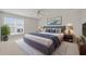 Comfortable bedroom boasts a plush bed, stylish decor, and sunlit windows at 554 Tranquil Waters Way, Summerville, SC 29486