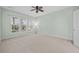 Bright bedroom features neutral carpet, pale green walls, and windows for natural light at 554 Tranquil Waters Way, Summerville, SC 29486