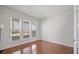 Bright bedroom with hardwood floors, natural light, and a charming French door at 554 Tranquil Waters Way, Summerville, SC 29486