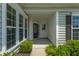 This home features a covered front porch, perfect for enjoying the outdoors at 554 Tranquil Waters Way, Summerville, SC 29486