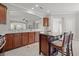 Bright kitchen features granite counters, dark cabinets, stainless appliances and center island at 554 Tranquil Waters Way, Summerville, SC 29486
