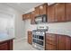 Updated kitchen featuring stainless steel oven and microwave with white and gray granite countertops at 554 Tranquil Waters Way, Summerville, SC 29486
