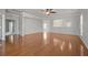 Spacious living room featuring an open floor plan, hardwood floors, and lots of natural light at 554 Tranquil Waters Way, Summerville, SC 29486