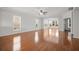 Bright living room features hardwood floors, large windows, and elegant architectural details at 554 Tranquil Waters Way, Summerville, SC 29486