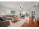 Comfortable living room with plush seating, warm rug, and a view into the dining area at 554 Tranquil Waters Way, Summerville, SC 29486