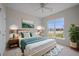 Relaxing main bedroom boasts natural light, plush bedding and stylish decor at 554 Tranquil Waters Way, Summerville, SC 29486