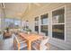 Sunroom featuring tile flooring, ample seating, and a dining area, great for entertaining at 554 Tranquil Waters Way, Summerville, SC 29486