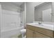 Bathroom includes shower/bath and vanity with contemporary fixtures at 5554 Colonial Chatsworth Cir, North Charleston, SC 29418