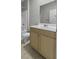 Bathroom includes shower/bath and vanity with contemporary fixtures at 5554 Colonial Chatsworth Cir, North Charleston, SC 29418